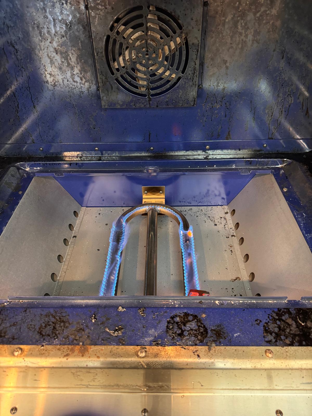 Gas oven bake burner operating during a service check
